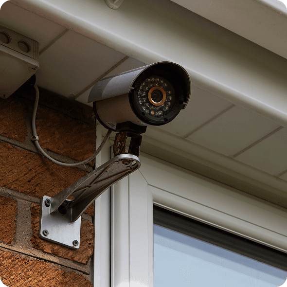 Outdoor security camera mounted on wall.
